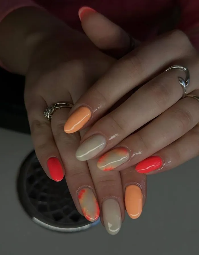 Sunset orange and cream tie-dye nail art